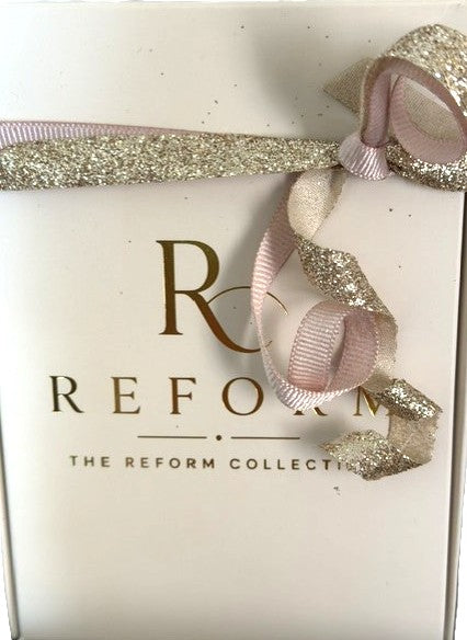 Reform 3-Pen Perfume Gift Set with pink Lumiere No. 2, blue Reserve No. 3, and teal Élan No. 5 travel fragrances.

