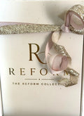 Reform 3-Pen Perfume Gift Set with pink Lumiere No. 2, blue Reserve No. 3, and teal Élan No. 5 travel fragrances.

