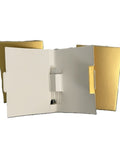 Open cream and gold Reform fragrance sample-set package displaying a scent vial inside.